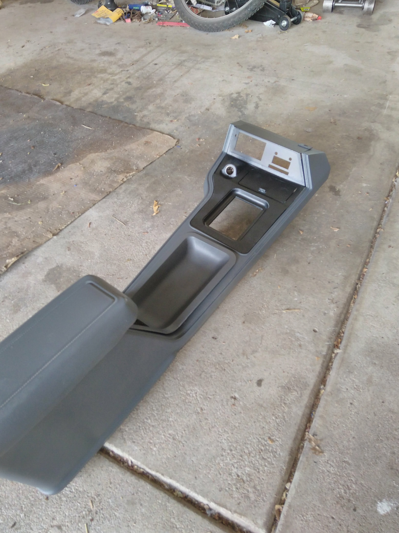 Illustration for article titled Gross looking worn Mustang center console